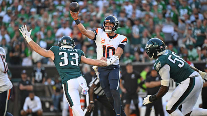 Oct 5, 2025; Philadelphia, Pennsylvania, USA; Denver Broncos quarterback Bo Nix (10) throws a pass order Philadelphia Eagles cornerback Cooper Dejean (33) during the fourth quarter at Lincoln Financial Field. Mandatory Credit: Eric Hartline-Imagn Images