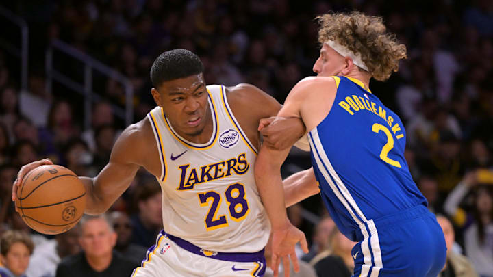 Oct 12, 2025; Los Angeles, California, USA;  Los Angeles Lakers forward Rui Hachimura (28) is defended by Golden State Warriors guard Brandin Podziemski (2) during the first half at Crypto.com Arena. Mandatory Credit: Jayne Kamin-Oncea-Imagn Images
