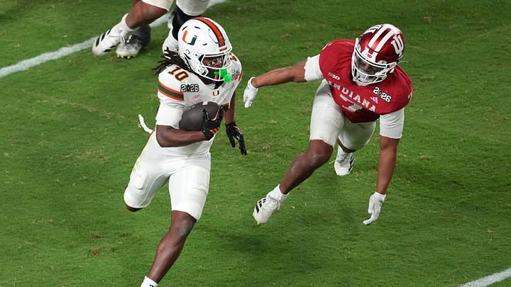Jan 19, 2026; Miami Gardens, FL, USA; Miami Hurricanes wide receiver Malachi Toney (10) runs with the ball for a touchdown against the Indiana Hoosiers during the second half of the College Football Playoff National Championship game at Hard Rock Stadium. Mandatory Credit: James Lang-Imagn Images
