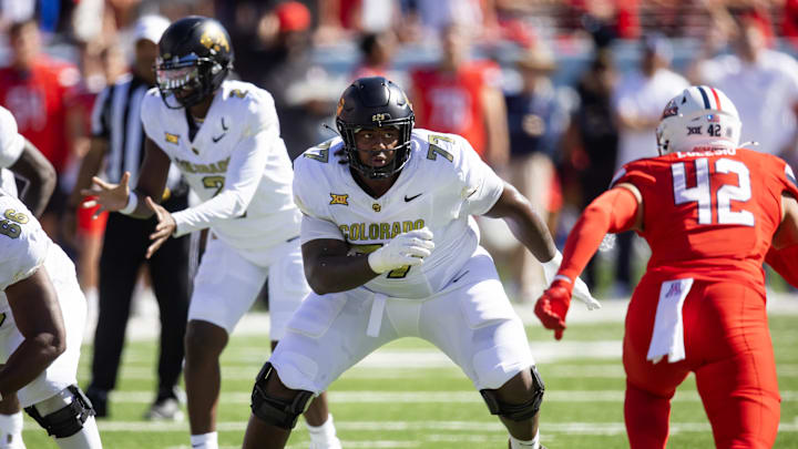 Oct 19, 2024; Tucson, Arizona, USA; Colorado Buffalos offensive tackle Jordan Seaton (77) against the Arizona Wildcats at Arizona Stadium. Mandatory Credit: Mark J. Rebilas-Imagn Images