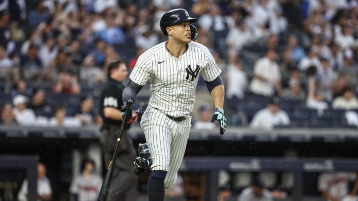 Jun 22, 2024; Bronx, New York, USA;  New York Yankees designated hitter Giancarlo Stanton (27) hits a double against the Atlanta Braves in the fourth inning at Yankee Stadium. Mandatory Credit: Wendell Cruz-USA TODAY Sports