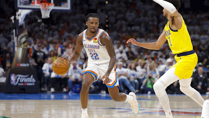 Jun 5, 2025; Oklahoma City, Oklahoma, USA; Oklahoma City Thunder guard Cason Wallace (22) looks to move the ball past Indiana Pacers guard Tyrese Haliburton (0) during the third quarter during game one of the 2025 NBA Finals at Paycom Center. Mandatory Credit: Alonzo Adams-Imagn Images