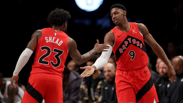 Mar 26, 2025; Brooklyn, New York, USA; Toronto Raptors guard RJ Barrett (9) high fives guard Jamal Shead (23) during the second quarter against the Brooklyn Nets at Barclays Center. Mandatory Credit: Brad Penner-Imagn Images