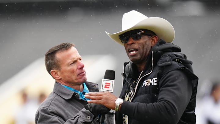Apr 22, 2023; Boulder, CO, USA; Colorado Buffaloes head coach Deion Sanders is interviewed by ESPN broadcaster Quint Kessenich during the first half of a spring game at Folsom Field. Mandatory Credit: Ron Chenoy-Imagn Images Apr 22, 2023; Boulder, CO, USA; Colorado Buffaloes head coach Deion Sanders is interviewed by ESPN broadcaster Quint Kessenich during the first half of a spring game at Folsom Field. Mandatory Credit: Ron Chenoy-Imagn Images