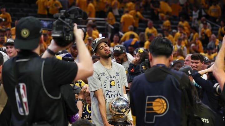 May 31, 2025; Indianapolis, Indiana, USA; Indiana Pacers guard Tyrese Haliburton (0) holds the trophy after game six of the eastern conference finals against the New York Knicks for the 2025 NBA Playoffs at Gainbridge Fieldhouse. Mandatory Credit: Trevor Ruszkowski-Imagn Images