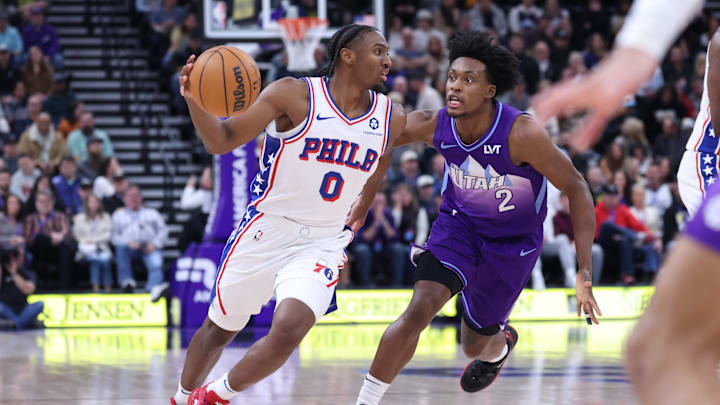 Dec 28, 2024; Salt Lake City, Utah, USA; Philadelphia 76ers guard Tyrese Maxey (0) drives against Utah Jazz guard Collin Sexton (2) during the second quarter at Delta Center. Mandatory Credit: Rob Gray-Imagn Images