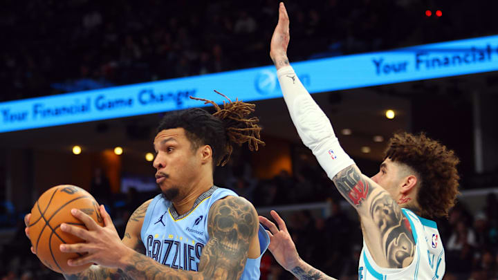 Jan 22, 2025; Memphis, Tennessee, USA; Memphis Grizzlies forward Brandon Clarke (15) collects a rebound over Charlotte Hornets guard LaMelo Ball (1) during the fourth quarter at FedExForum. Mandatory Credit: Petre Thomas-Imagn Images Jan 22, 2025; Memphis, Tennessee, USA; Memphis Grizzlies forward Brandon Clarke (15) collects a rebound over Charlotte Hornets guard LaMelo Ball (1) during the fourth quarter at FedExForum. Mandatory Credit: Petre Thomas-Imagn Images
