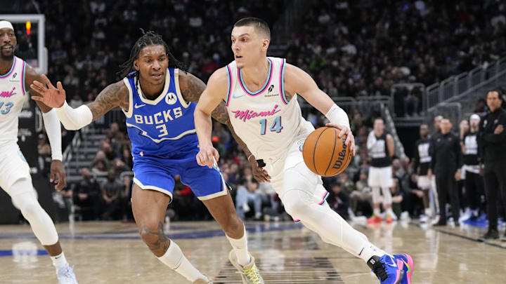 Feb 23, 2025; Milwaukee, Wisconsin, USA; Miami Heat guard Tyler Herro (14) drives for the basket in front to Milwaukee Bucks guard Kevin Porter Jr. (3) during the fourth quarter at Fiserv Forum. Mandatory Credit: Jeff Hanisch-Imagn Images Feb 23, 2025; Milwaukee, Wisconsin, USA; Miami Heat guard Tyler Herro (14) drives for the basket in front to Milwaukee Bucks guard Kevin Porter Jr. (3) during the fourth quarter at Fiserv Forum. Mandatory Credit: Jeff Hanisch-Imagn Images