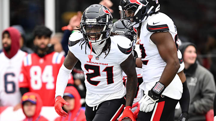Oct 13, 2024; Foxborough, Massachusetts, USA; Houston Texans safety Calen Bullock (21) celebrates after recovering a fumble against the New England Patriots during the second half at Gillette Stadium. Mandatory Credit: Brian Fluharty-Imagn Images