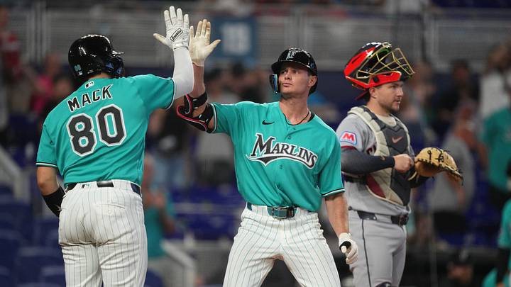 Miami Marlins’ Griffin Conine, right, celebrates a solo home run. Miami Marlins’ Griffin Conine, right, celebrates a solo home run.