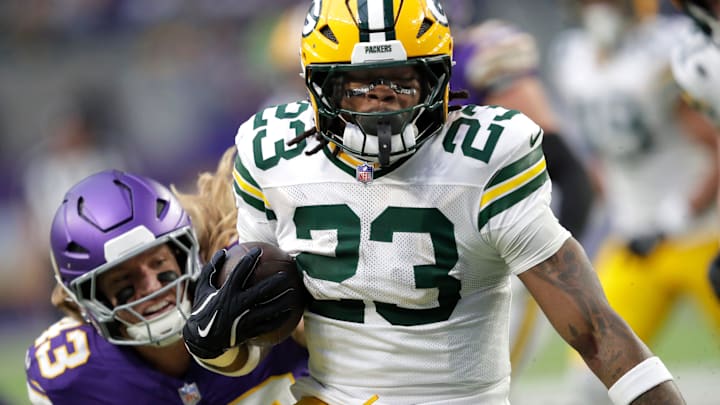 Green Bay Packers running back Emanuel Wilson (23) loses 18-yards on a run against the Minnesota Vikings during their football game Sunday, January 4, 2026, at U.S. Bank Stadium in Minneapolis, Minnesota.