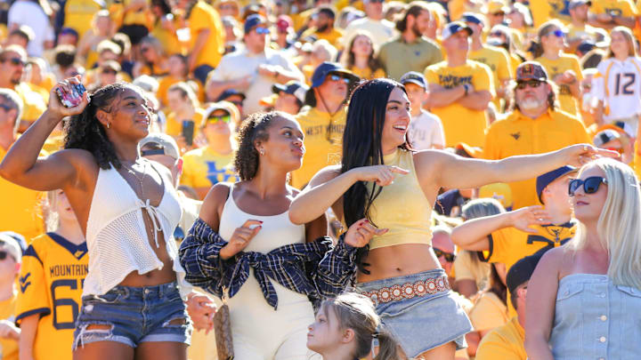 Aug 30, 2025; Morgantown, West Virginia, USA; West Virginia Mountaineers fans cheer during the third quarter against the Robert Morris Colonials at Milan Puskar Stadium. Mandatory Credit: Ben Queen-Imagn Images
