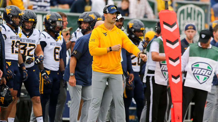 Sep 6, 2025; Athens, Ohio, USA; West Virginia Mountaineers defensive coordinator Zac Alley calls out plays from the sidelines during the first quarter against the West Virginia Mountaineers at Peden Stadium. Mandatory Credit: Ben Queen-Imagn Images