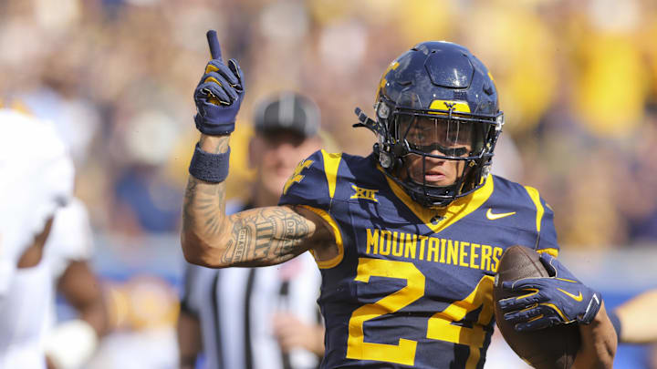 Sep 13, 2025; Morgantown, West Virginia, USA; West Virginia Mountaineers wide receiver Rodney Gallagher III (24) celebrates a first down after a catch during the first quarter against the Pittsburgh Panthers at Milan Puskar Stadium. Mandatory Credit: Ben Queen-Imagn Images