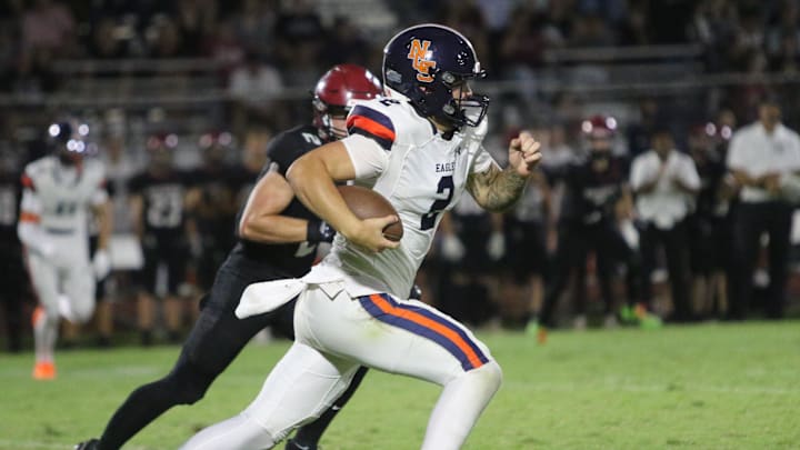Nashville Christian quarterback Jared Curtis (2) sprints down field against Davidson Academy in a TSSAA football season-opening 56-28 win on Aug. 22, 2025 at Davidson Academy in Nashville, Tennessee.
