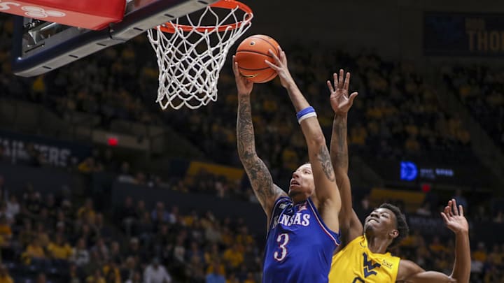 Jan 10, 2026; Morgantown, West Virginia, USA; Kansas Jayhawks guard Tre White (3) dunks the ball during the first half against the West Virginia Mountaineers at Hope Coliseum. Mandatory Credit: Ben Queen-Imagn Images Jan 10, 2026; Morgantown, West Virginia, USA; Kansas Jayhawks guard Tre White (3) dunks the ball during the first half against the West Virginia Mountaineers at Hope Coliseum. Mandatory Credit: Ben Queen-Imagn Images
