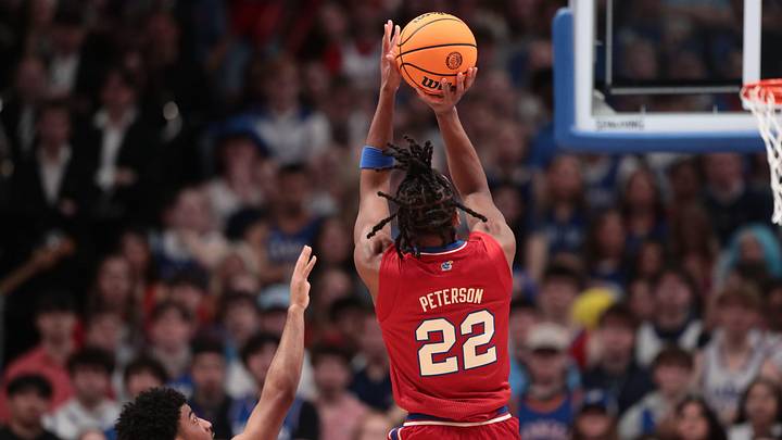 Kansas Jayhawks guard Darryn Peterson (22) shoots for three against Kansas State Wildcats during the Sunflower Showdown game inside Allen Fieldhouse in Lawrence, Kansas, on Saturday, March 7, 2026. Kansas Jayhawks guard Darryn Peterson (22) shoots for three against Kansas State Wildcats during the Sunflower Showdown game inside Allen Fieldhouse in Lawrence, Kansas, on Saturday, March 7, 2026.