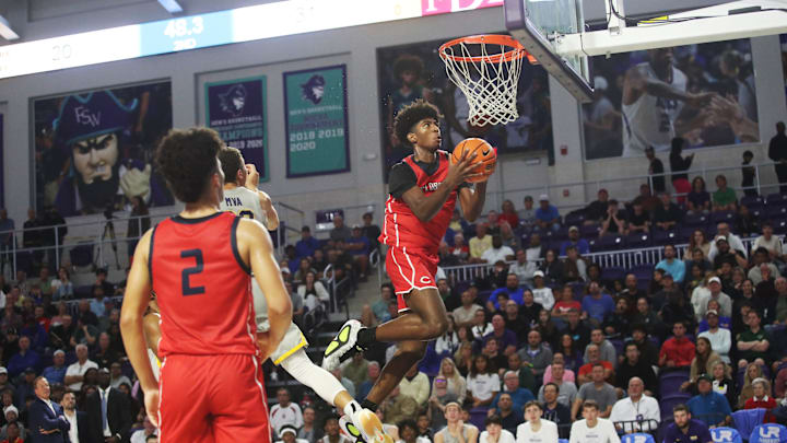 Jaxon Richardson of the Miami Columbus High School basketball team drives to the basket during the championship game against Montverde at the City of Palms Classic at Suncoast Credit Union Arena in Fort Myers on Monday, Dec. 23, 2024.