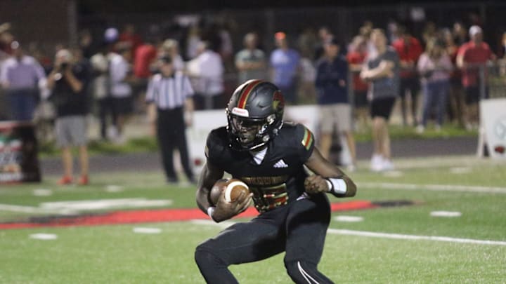 Ravenwood's Femi Babalola makes a move to make an Alcoa defender miss in the fourth quarter of their game Friday, August 18, 2023 at Ravenwood High School in Brentwood, Tennessee.