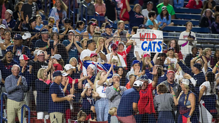 Jun 3, 2022; Oklahoma City, Oklahoma, USA;  Arizona Wildcats fans cheer during the sixth inning of the NCAA Women's College World Series game against the Oregon State Beavers at USA Softball Hall of Fame Stadium. Arizona won 3-1. Mandatory Credit: Brett Rojo-Imagn Images