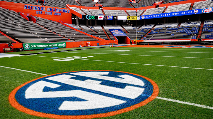The SEC logo in orange and blue colors is painted on the field before the game between the Florida Gators and Arkansas Razorbacks at Steve Spurrier Field at Ben Hill Griffin Stadium in Gainesville, FL on Saturday, November 4, 2023. [Matt Pendleton/Gainesville Sun]