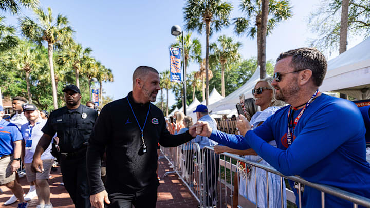 Florida Gators head coach Billy Napier shakes hands with fans during Gator Walk at the Orange and Blue spring football game at Steve Spurrier Field at Ben Hill Griffin Stadium in Gainesville, FL on Saturday, April 13, 2024. [Matt Pendleton/Gainesville Sun]