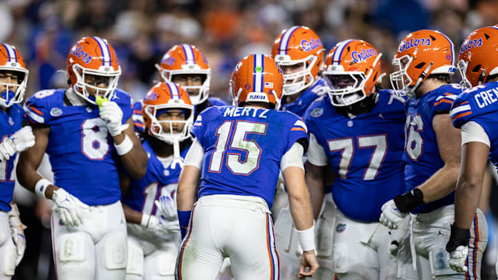 Oct 5, 2024; Gainesville, Florida, USA; Florida Gators quarterback Graham Mertz (15) calls a play in the huddle against the UCF Knights during the second half at Ben Hill Griffin Stadium. Mandatory Credit: Matt Pendleton-Imagn Images