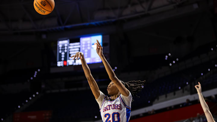 Florida Gators guard Jeriah Warren (20) attempts a three-point shot against the St. John's Red Storm during the second half at Billy Donovan Court at Stephen C. O'Connell Center in Gainesville, FL on Thursday, March 21, 2024. [Matt Pendleton/Gainesville Sun]