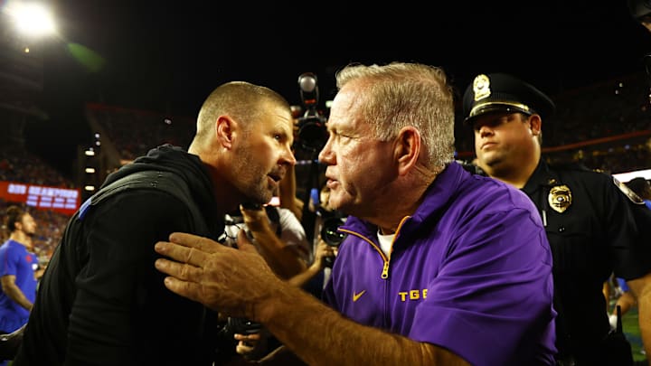 Nov 16, 2024; Gainesville, Florida, USA; LSU Tigers head coach Brian Kelly and Florida Gators head coach Billy Napier greet after the game at Ben Hill Griffin Stadium. Mandatory Credit: Kim Klement Neitzel-Imagn Images