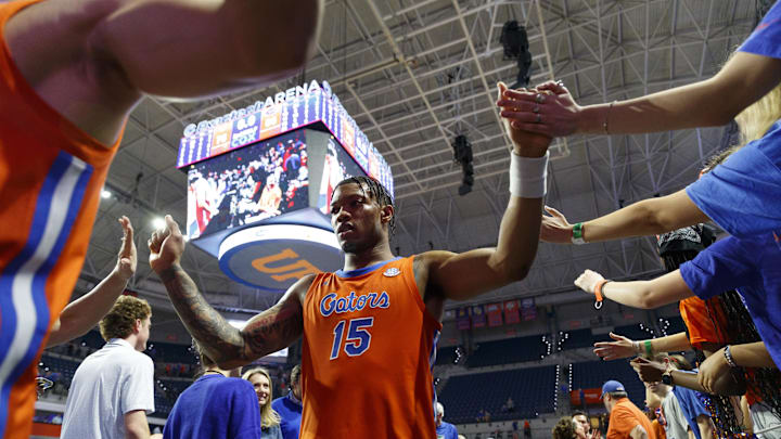 Feb 4, 2025; Gainesville, Florida, USA; Florida Gators guard Alijah Martin (15) high fives fans after the game against Vanderbilt Commodores at Exactech Arena at the Stephen C. O'Connell Center. Mandatory Credit: Morgan Tencza-Imagn Images