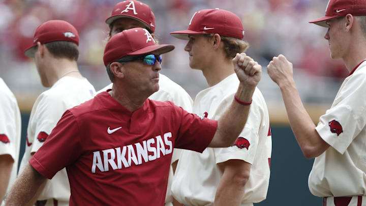Jun 17, 2018; Omaha, NE, USA; Arkansas Razorbacks head coach Dave Van Horn fist bumps his past layers prior to the game against the Texas Longhorns at TD Ameritrade Park. Mandatory Credit: Bruce Thorson-Imagn Images