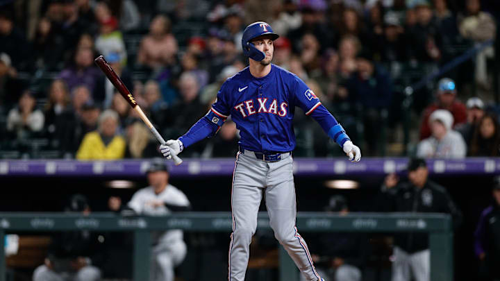 May 10, 2024; Denver, Colorado, USA; Texas Rangers outfielder Evan Carter (32) after striking out in