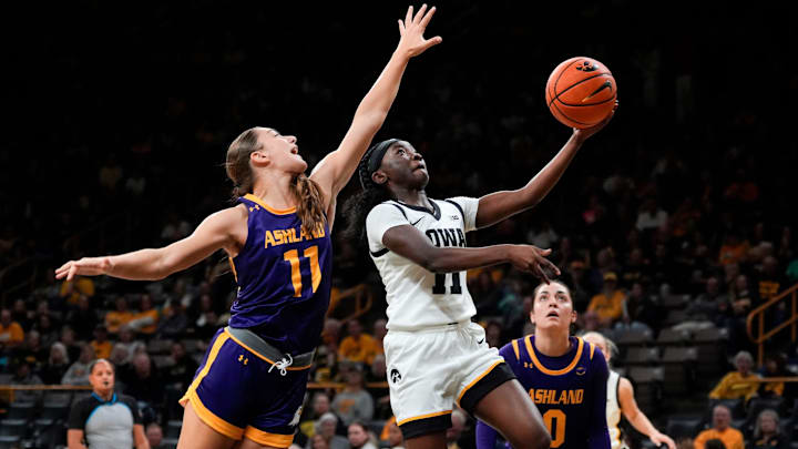 Iowa guard Chit-Chat Wright (11) drives to the basket defended by Ashland guard Gia Casalinova (11) Oct. 30, 2025 during an exhibition game at Carver-Hawkeye Arena in Iowa City, Iowa. Iowa guard Chit-Chat Wright (11) drives to the basket defended by Ashland guard Gia Casalinova (11) Oct. 30, 2025 during an exhibition game at Carver-Hawkeye Arena in Iowa City, Iowa.