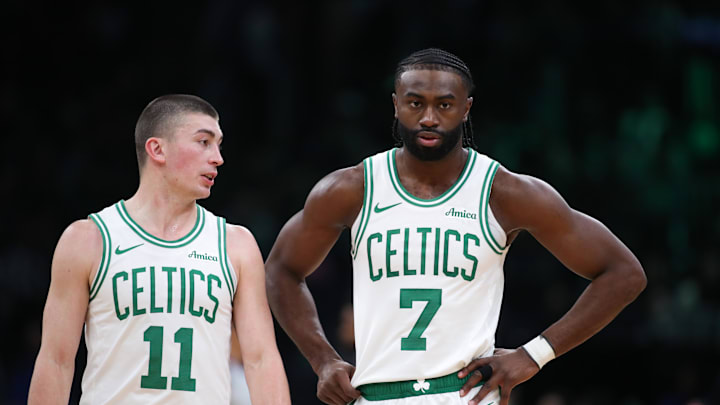 Dec 7, 2024; Boston, Massachusetts, USA; Boston Celtics forward Jaylen Brown (7) and Boston Celtics guard Payton Pritchard (11) talk during the first half against the Memphis Grizzlies at TD Garden. Mandatory Credit: Paul Rutherford-Imagn Images