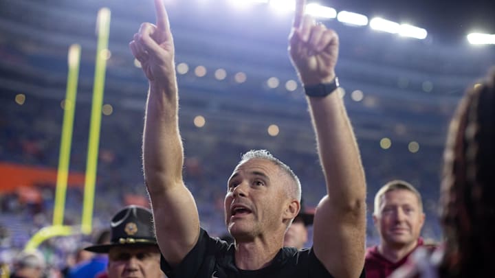 Florida State Seminoles head coach Mike Norvell gestures towards the crowd after the game against