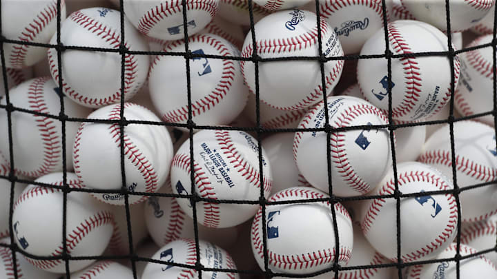 Jul 14, 2023; Pittsburgh, Pennsylvania, USA; Batting practice baseballs sit in a basket on the field