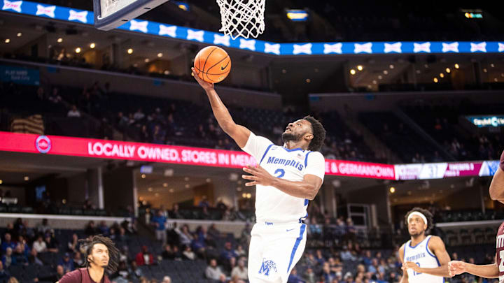 The Memphis Tigers Alex Lomax (2) lays the ball up during a game against the Little Rock Trojans on