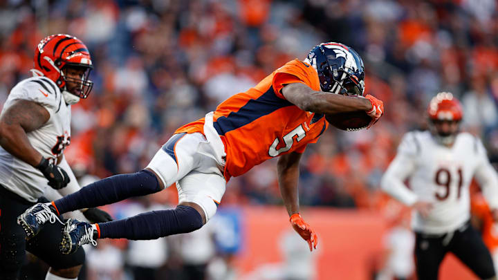 Dec 19, 2021; Denver, Colorado, USA; Denver Broncos quarterback Teddy Bridgewater (5) dives with the