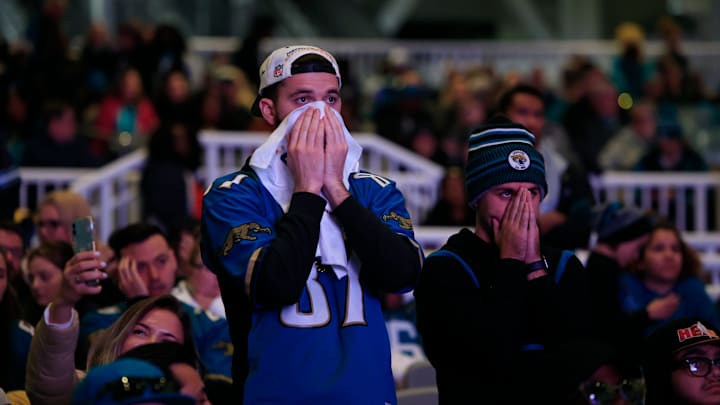 Garrett Johnson (87) and Daniel Cannady react to the sting of defeat as seconds tick off the clock during the second half Saturday, Jan 21, 2023 at TIAA Bank Field's Dream Finders Homes Flex Field at Daily's Place in Jacksonville, Fla. Thousands came out to a watch party to cheer on the Jacksonville Jaguars via big screen as they faced the Kansas City Chiefs in an AFC divisional round playoff game held at Arrowhead Stadium in Kansas City, Mo. T
