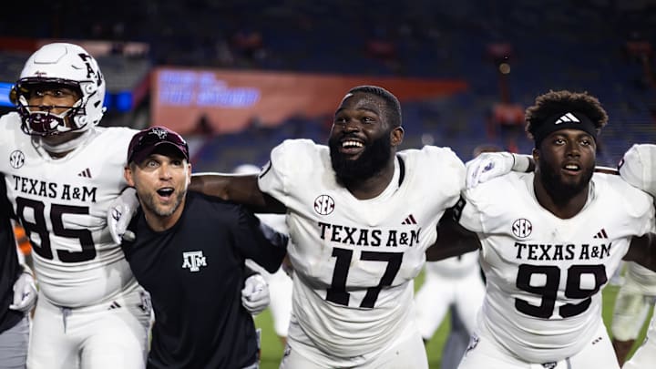 Sep 14, 2024; Gainesville, Florida, USA; Texas A&M Aggies tight end Jaden Platt (85), defensive lineman Albert Regis (17), and defensive lineman Gabriel Brownlow-Dindy (99) celebrate after defeating the Florida Gators at Ben Hill Griffin Stadium. Mandatory Credit: Matt Pendleton-Imagn Images