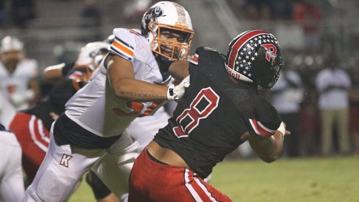 Kirkwood offensive lineman Kamari Blair (51) shoves a Rossview defender on a Cobras run play during the second quarter during the a game against Rossview, Thursday, September 26, at Rossview High School in Clarksville, Tennessee.