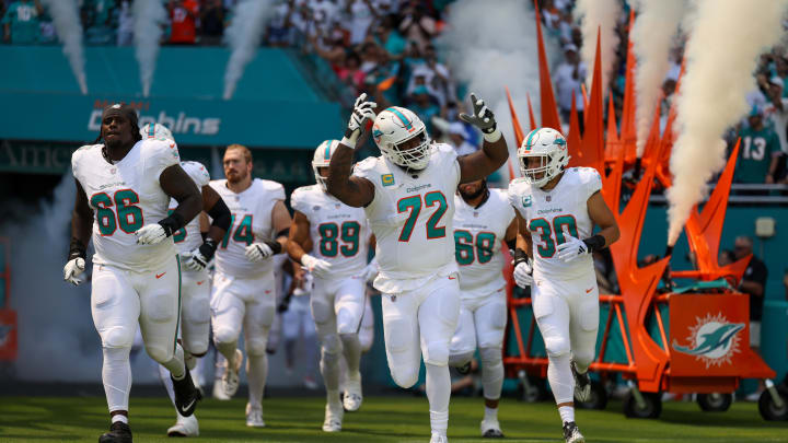 Miami Dolphins offensive tackle Terron Armstead (72) leads the team onto the field before the 2023 home opener against the Denver Broncos at Hard Rock Stadium. Miami Dolphins offensive tackle Terron Armstead (72) leads the team onto the field before the 2023 home opener against the Denver Broncos at Hard Rock Stadium.