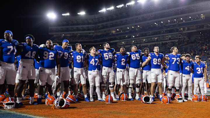 Oct 5, 2024; Gainesville, Florida, USA; Florida Gators quarterback DJ Lagway (2), offensive lineman Austin Barber (58), and teammates sing after a game against the UCF Knights at Ben Hill Griffin Stadium. Mandatory Credit: Matt Pendleton-Imagn Images
