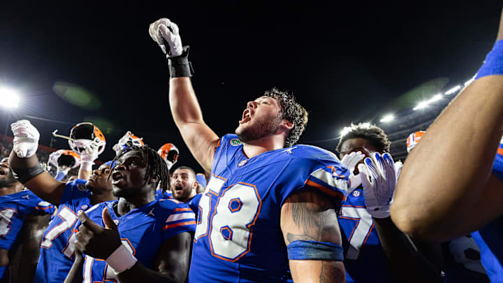 Nov 16, 2024; Gainesville, Florida, USA; Florida Gators offensive lineman Austin Barber (58) cheers with Florida Gators running back Jadan Baugh (13) after a game against the LSU Tigers at Ben Hill Griffin Stadium. Mandatory Credit: Matt Pendleton-Imagn Images Nov 16, 2024; Gainesville, Florida, USA; Florida Gators offensive lineman Austin Barber (58) cheers with Florida Gators running back Jadan Baugh (13) after a game against the LSU Tigers at Ben Hill Griffin Stadium. Mandatory Credit: Matt Pendleton-Imagn Images