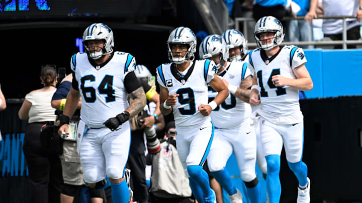 Oct 5, 2025; Charlotte, North Carolina, USA; Carolina Panthers center Cade Mays (64) and quarterback Bryce Young (9) and center Nick Samac and quarterback Andy Dalton (14) run on to the field before the game at Bank of America Stadium. Mandatory Credit: Bob Donnan-Imagn Images Oct 5, 2025; Charlotte, North Carolina, USA; Carolina Panthers center Cade Mays (64) and quarterback Bryce Young (9) and center Nick Samac and quarterback Andy Dalton (14) run on to the field before the game at Bank of America Stadium. Mandatory Credit: Bob Donnan-Imagn Images