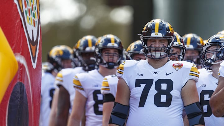 Jan 1, 2024; Orlando, FL, USA; Iowa Hawkeyes offensive lineman Mason Richman (78) leads the defense out of the tunnel for warm-ups before the game against the Tennessee Volunteers at Camping World Stadium. Mandatory Credit: Morgan Tencza-Imagn Images Jan 1, 2024; Orlando, FL, USA; Iowa Hawkeyes offensive lineman Mason Richman (78) leads the defense out of the tunnel for warm-ups before the game against the Tennessee Volunteers at Camping World Stadium. Mandatory Credit: Morgan Tencza-Imagn Images