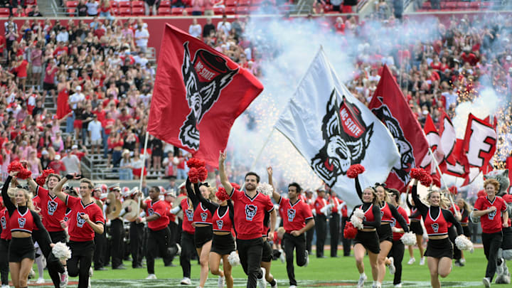 Nov 2, 2024; Raleigh, North Carolina, USA; North Carolina State Wolfpack cheerleaders during run out during the game against the Stanford Cardinals at Carter-Finley Stadium. Mandatory Credit: Zachary Taft-Imagn Images Nov 2, 2024; Raleigh, North Carolina, USA; North Carolina State Wolfpack cheerleaders during run out during the game against the Stanford Cardinals at Carter-Finley Stadium. Mandatory Credit: Zachary Taft-Imagn Images
