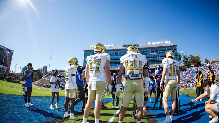 Oct 18, 2025; Durham, North Carolina, USA; Georgia Tech Yellow Jackets quarterback Haynes King (10), linebacker Kyle Efford (44), tight end Josh Beetham (17), and wide receiver Debron Gatling (6) walk out for the coin toss  before the first half of the game against Duke Blue Devils at Wallace Wade Stadium. Mandatory Credit: Jaylynn Nash-Imagn Images