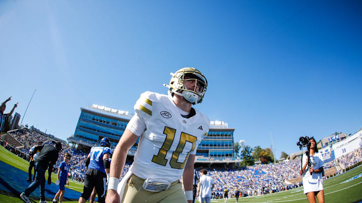 Oct 18, 2025; Durham, North Carolina, USA;  Georgia Tech Yellow Jackets quarterback Haynes King (10) runs back to the bench before the first half of the game against Duke Blue Devils at Wallace Wade Stadium. Mandatory Credit: Jaylynn Nash-Imagn Images