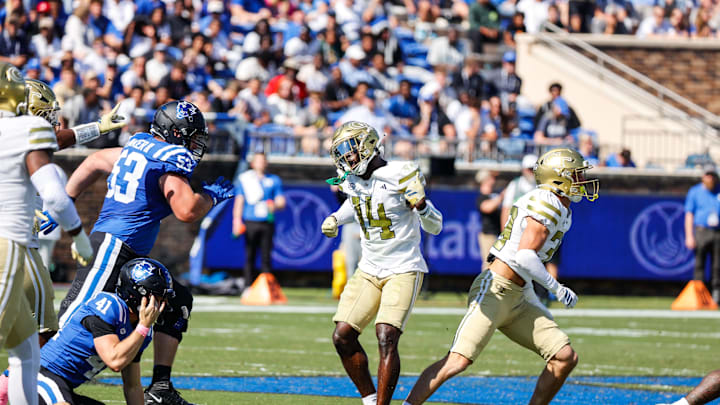 Oct 18, 2025; Durham, North Carolina, USA;  Georgia Tech Yellow Jackets defensive back Jy Gilmore (14) celebrates a tackle Xduring the first half of the game against Duke Blue Devils at Wallace Wade Stadium. Mandatory Credit: Jaylynn Nash-Imagn Images